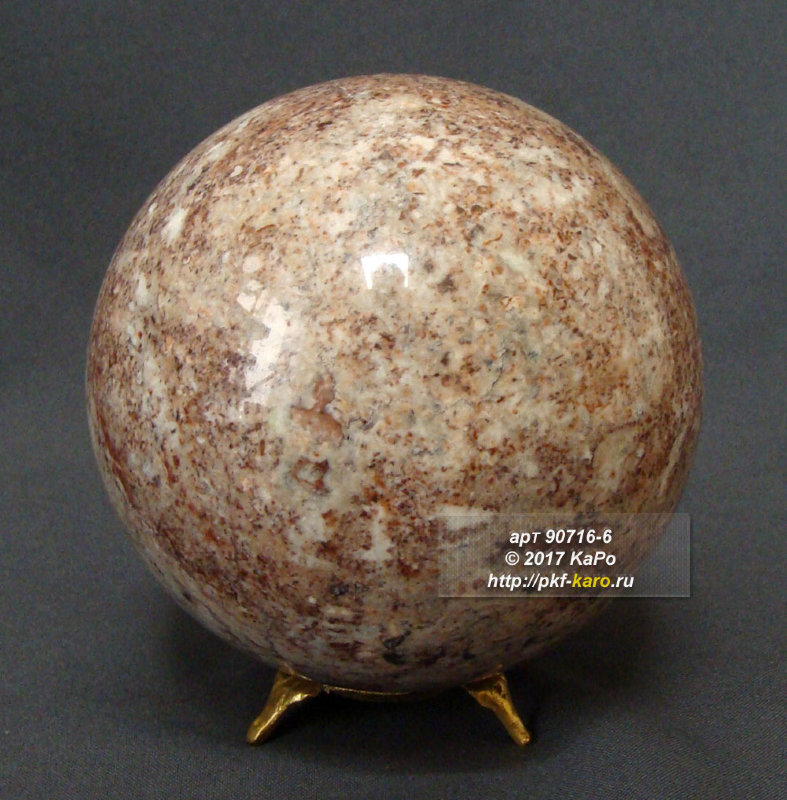 Шар из криноида (морской лилии) Шар из криноида (морской лилии). Данное фото представлено в качестве образца. На фото типовое изделие, оригинал может отличаться по размеру в указанных пределах, цвету, рисунку камня. Подставка артикул 73120 в стоимость не входит и может быть приобретена отдельно.
