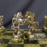 Шахматы "Римляне" с доской из змеевика  и металлическими фигурами на кабашонах из змеевика.