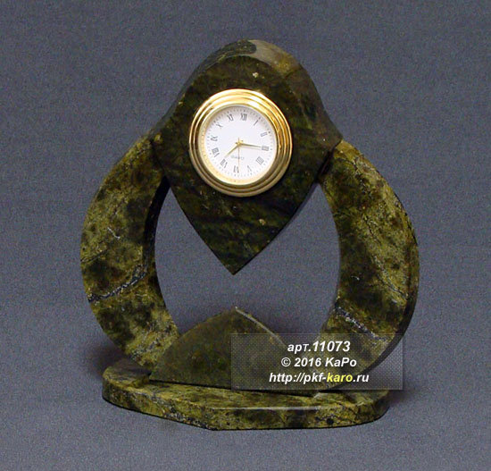 Часы &quot;Улитка&quot; Часы изготовлены из змеевика Баженовского месторождения. В комплекте кварцевый часовой механизм Д-40 мм. На фото типовое изделие, оригинал может отличаться по размеру и весу (в пределах 10%), цвету, рисунку камня. 