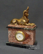 Часы каминные из криноида (морской лилии), змеевика и бронзы "Сфинкс"