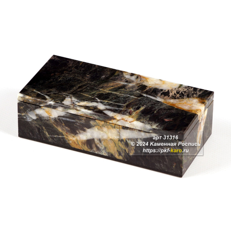 Шкатулка из пейзажной уральской яшмы и долерита Шкатулка из пейзажной уральской яшмы и долерита. Крышка закреплена на металлических шарнирах. Внутри шкатулка полирована. 
Дно из долерита внутри шкатулки покрыто бархатом. 
Внутренние размеры шкатулки: 125х50х25 мм. 
Цена указана за изделие представленное на фото. 
Обращаем внимание наших покупателей, что конструкция шарниров позволяет открывать крышку шкатулки на угол не более 80 градусов. 
Открытие крышки на угол больший чем 80 градусов может привести к поломке.