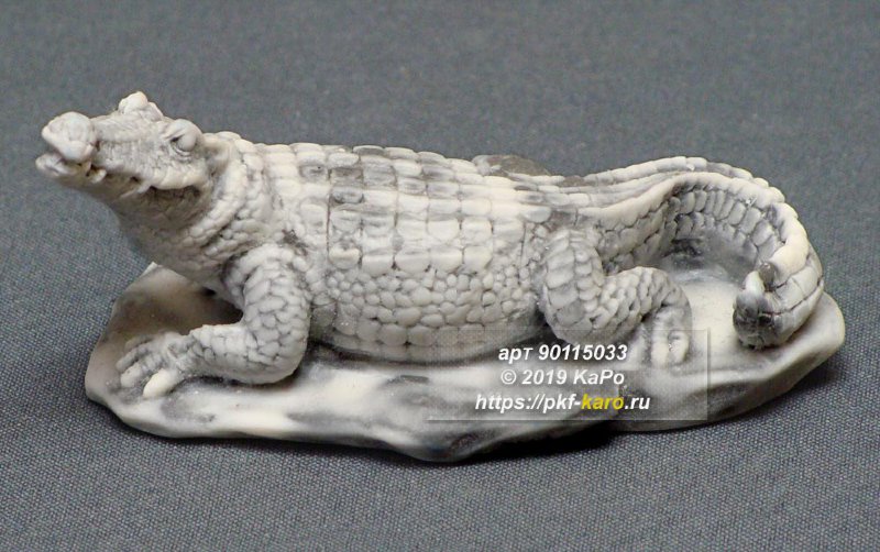 Фигурка из мрамолита &quot;Крокодил на камне&quot; Сувенир "Крокодил на камне" из мрамолита. На фото типовое изделие, оригинал может отличаться по размеру и весу (в пределах 10%), цвету, рисунку камня. 