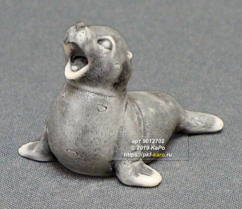 Фигурка из мрамолита "Тюлень" Сувенир "Тюлень" из мрамолита. На фото типовое изделие, оригинал может отличаться по цвету и рисунку камня.